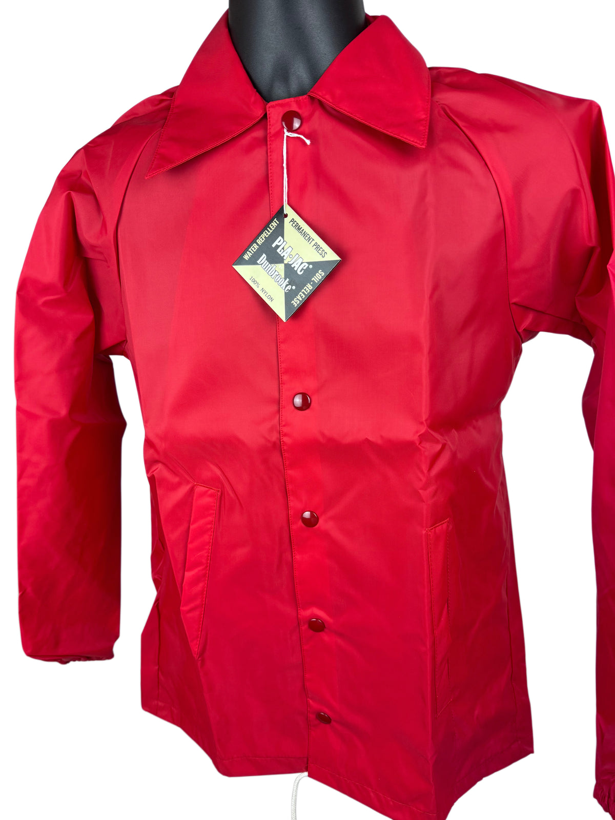 A bright red long-sleeve snap front nylon jacket displayed on a black mannequin torso against a white background, with a hangtag attached at the collar.
