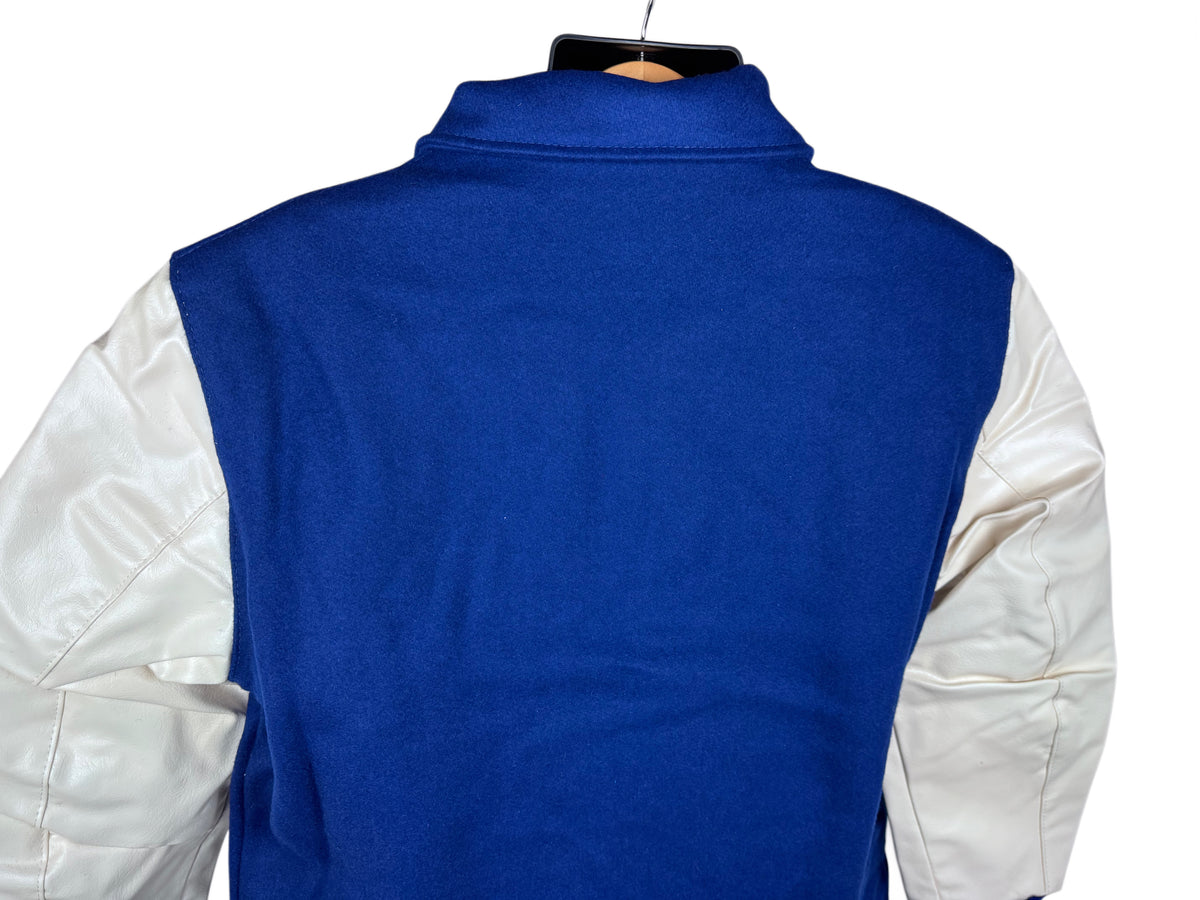 The back view of a lettermen's jacket with a solid royal blue body and contrasting white naugalite sleeves, displayed on a hanger against a white background.