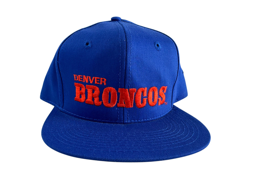 A royal blue flat-brim baseball cap with 'DENVER BRONCOS' embroidered in red on the front, shown against a plain white background.
