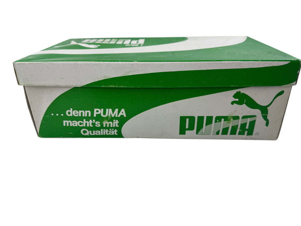 A Puma shoebox in green and white, featuring the Puma logo and German slogan '.