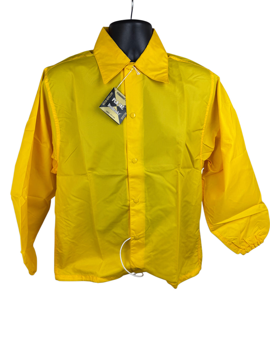 A bright yellow long-sleeve utility jacket displayed on a black mannequin torso against a white background, featuring a pointed collar, snap buttons, and a hangtag still attached near the collar.