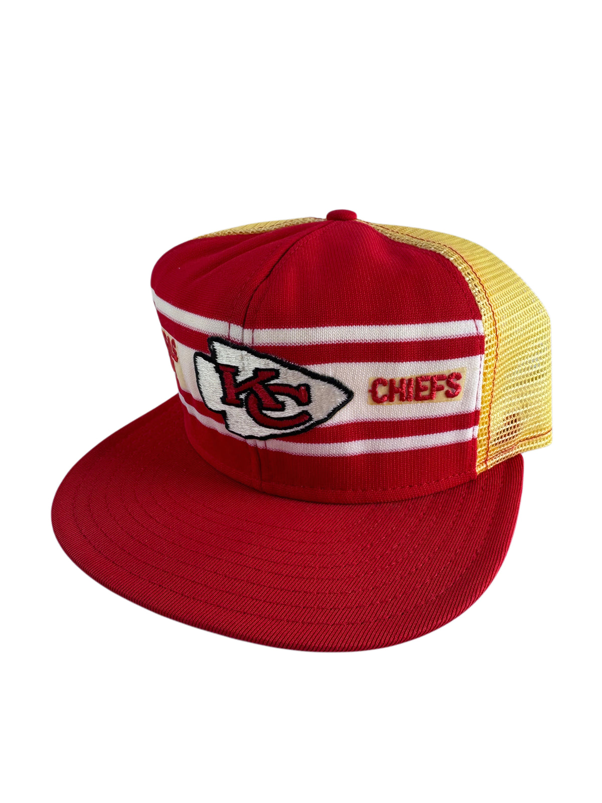 A red and yellow Kansas City Chiefs trucker hat with a red flat brim, featuring the team logo and 'CHIEFS' text on the front panels.