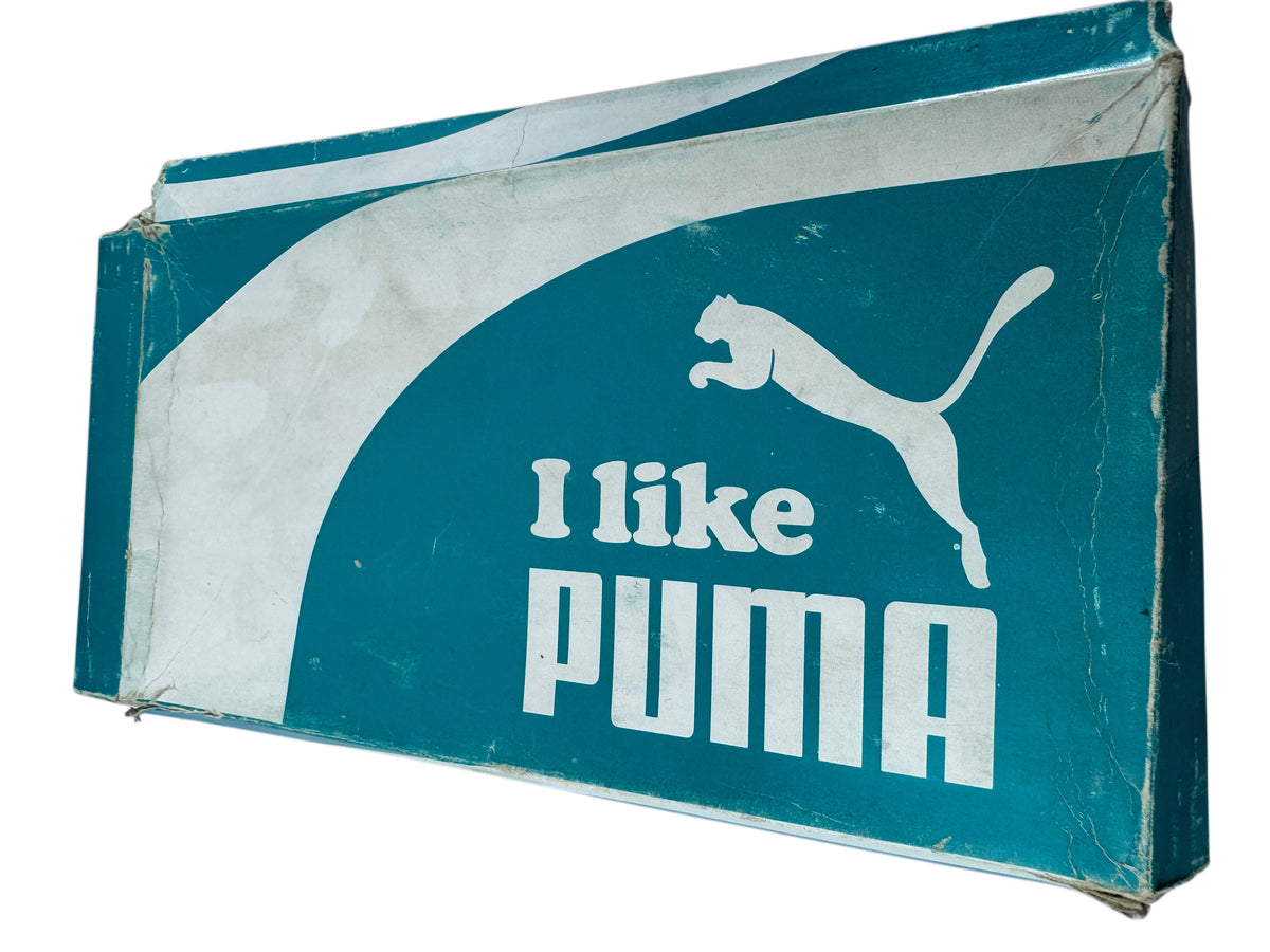 A vintage rectangular Puma shoe box with a teal and white design, featuring the Puma leaping cat logo and the text 'I like PUMA'.