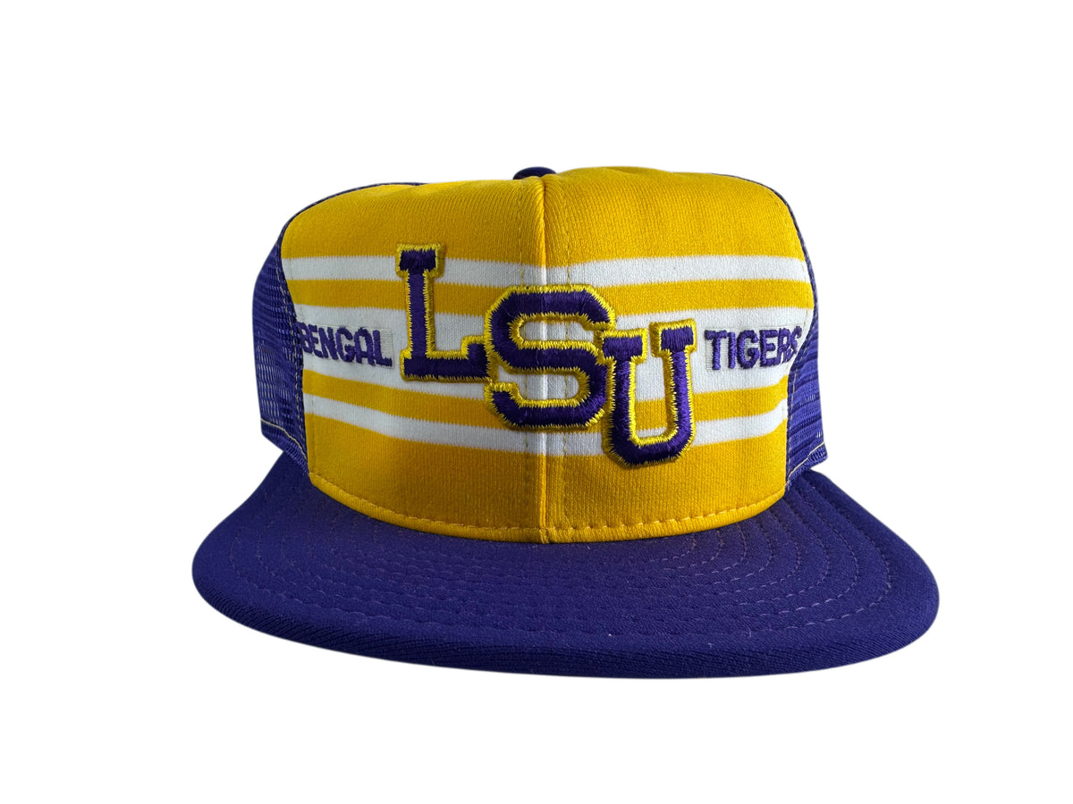 A yellow and purple LSU Tigers snapback cap with white stripes on the front panel and 'LSU' embroidered in purple and gold. The side panels are purple mesh, and 'BENGAL' is embroidered on the opposite side.
