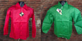Two glossy windbreaker jackets displayed on black mannequins against a brick wall background, one in bright red and one in bright green, both with visible hang tags.