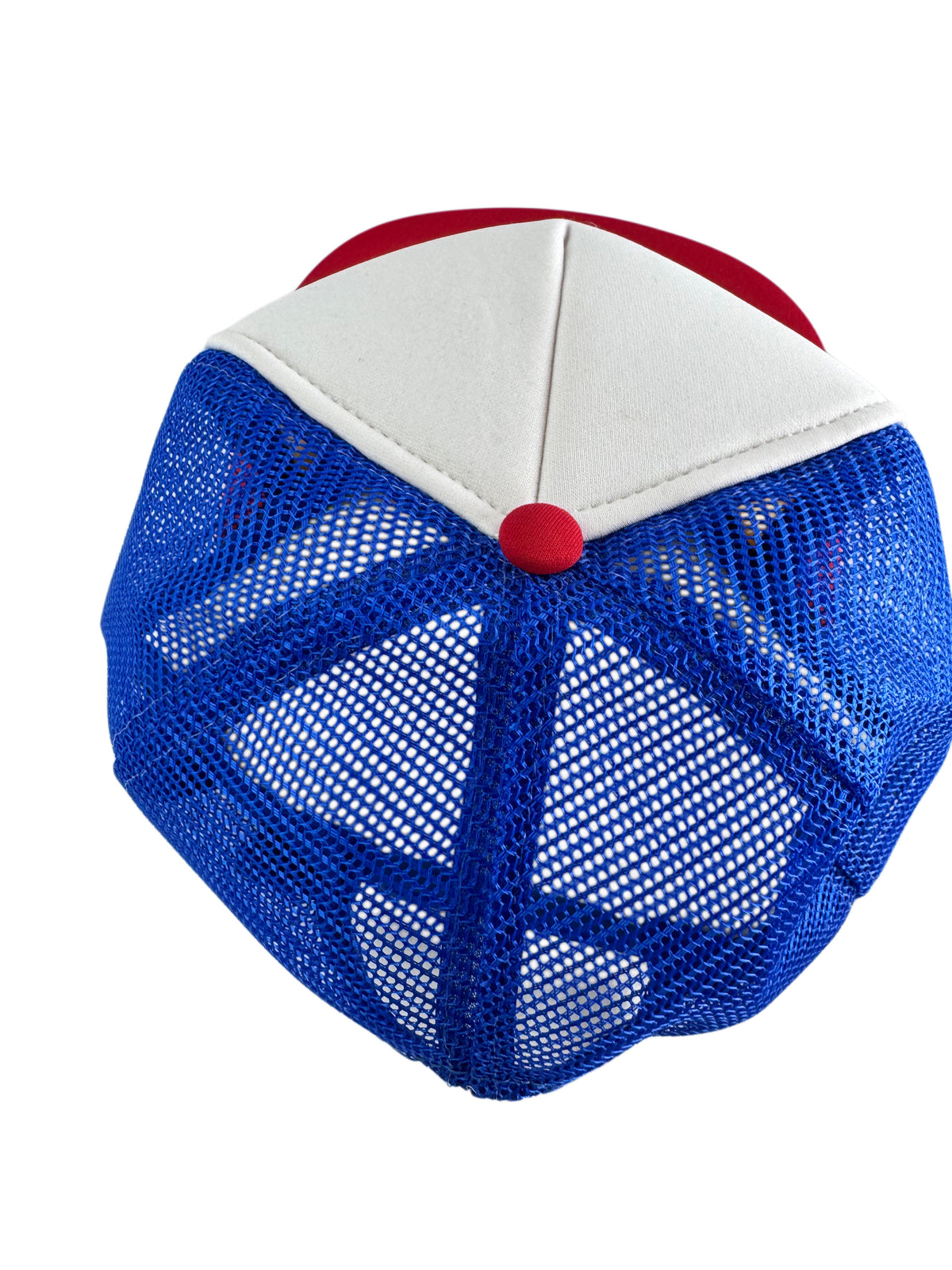 A close-up of the back of a trucker-style baseball cap with a blue mesh back, white front panels, and red trim and button.