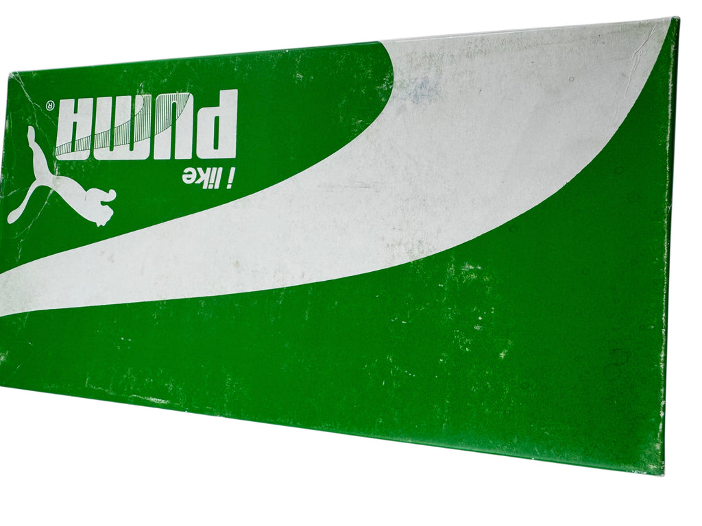 A rectangular green and white Puma sign featuring the Puma leaping cat logo and the word 'PUMA' in white, shown against a plain white background.