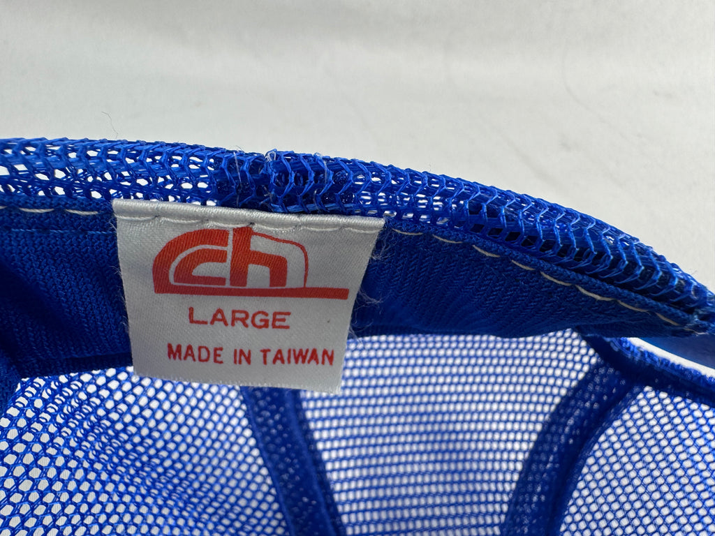 Close-up of a blue mesh product interior showing a white sewn-in label with a red logo and text reading LARGE and MADE IN TAIWAN.