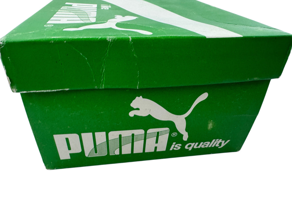 A green Puma shoebox with the white Puma logo and 'is quality' text on the front, photographed against a white background.