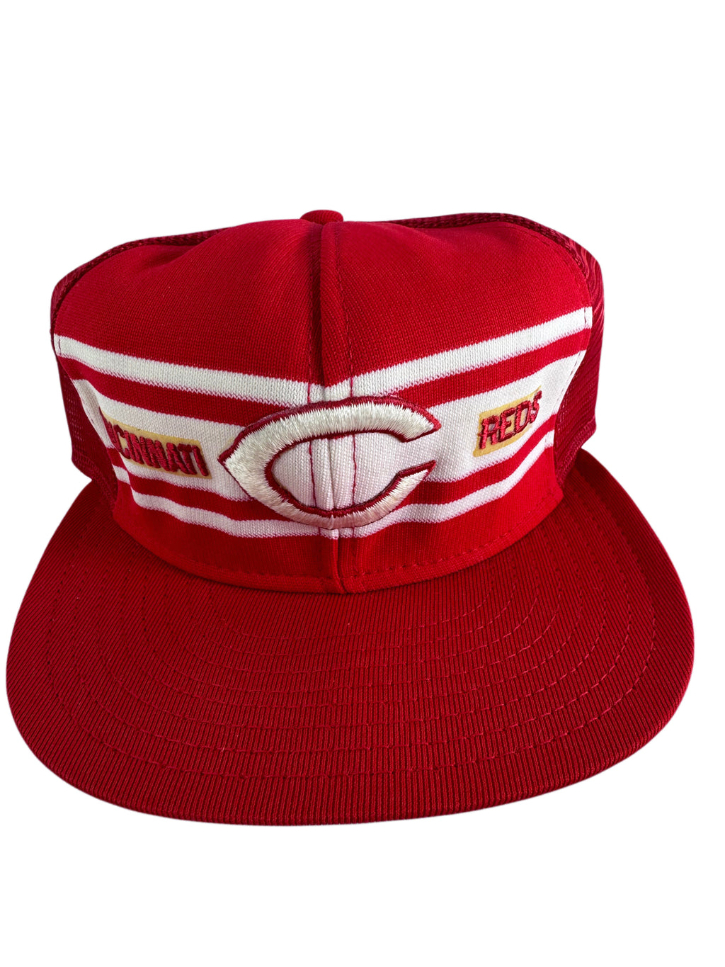 A red and white baseball cap featuring the Cincinnati Reds logo on the front panel, with a structured flat brim and embroidered details.