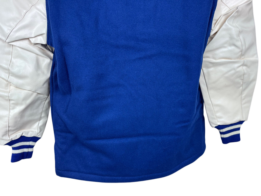 Close-up of the back of a varsity-style jacket with a royal blue body and white sleeves, shown against a plain white background.