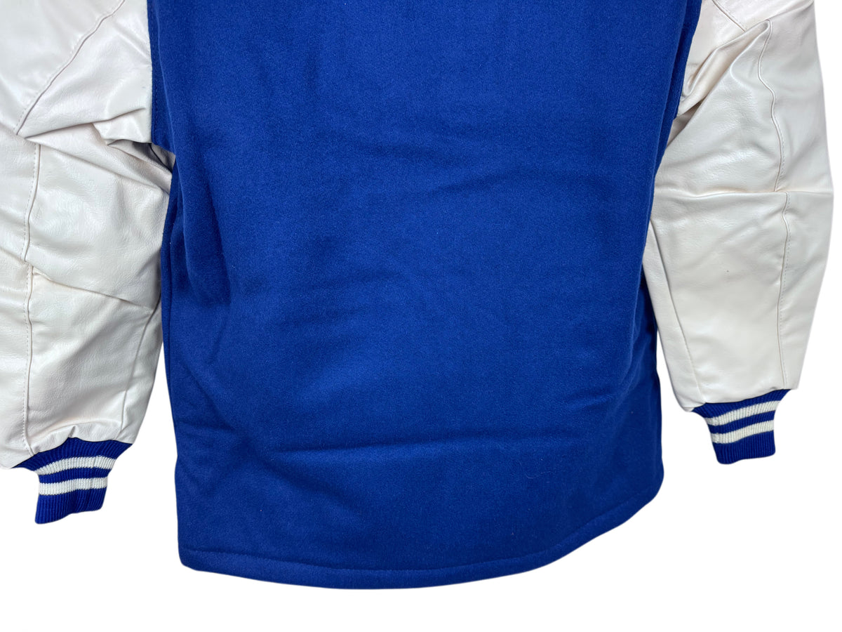 Close-up of the back of a varsity-style jacket with a royal blue body and white sleeves, shown against a plain white background.