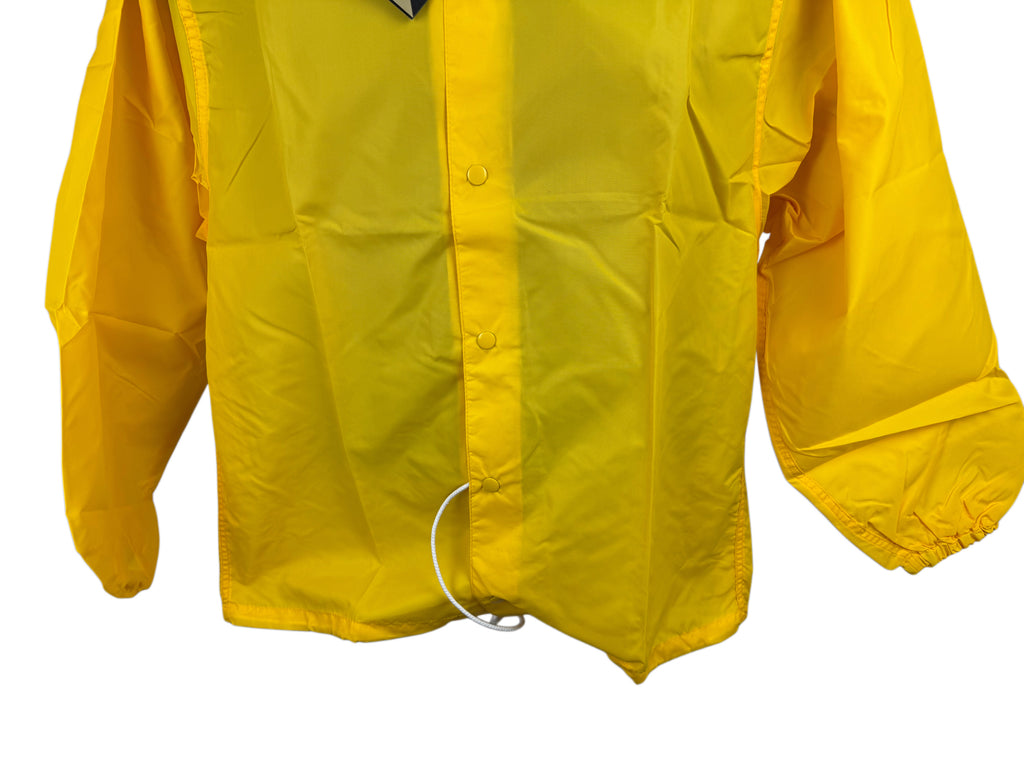 A bright yellow jacket with a snap-front closure front, long sleeves, and a white drawcord ring at the hem, shown against a plain white background.