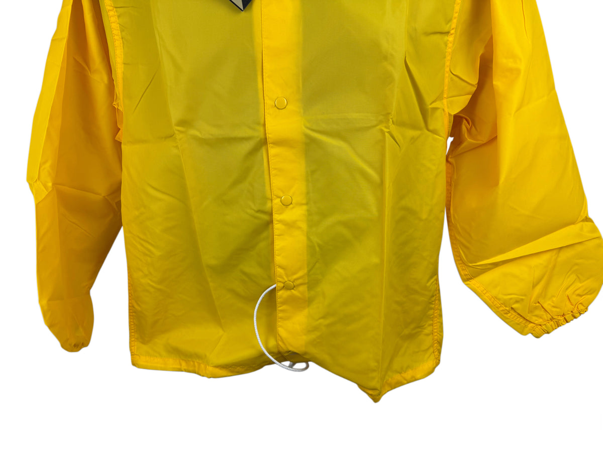 A bright yellow jacket with a snap-front closure front, long sleeves, and a white drawcord ring at the hem, shown against a plain white background.